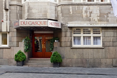 Front view of Amrâth Hotel DuCasque in Maastricht, a classic building with a stone facade.